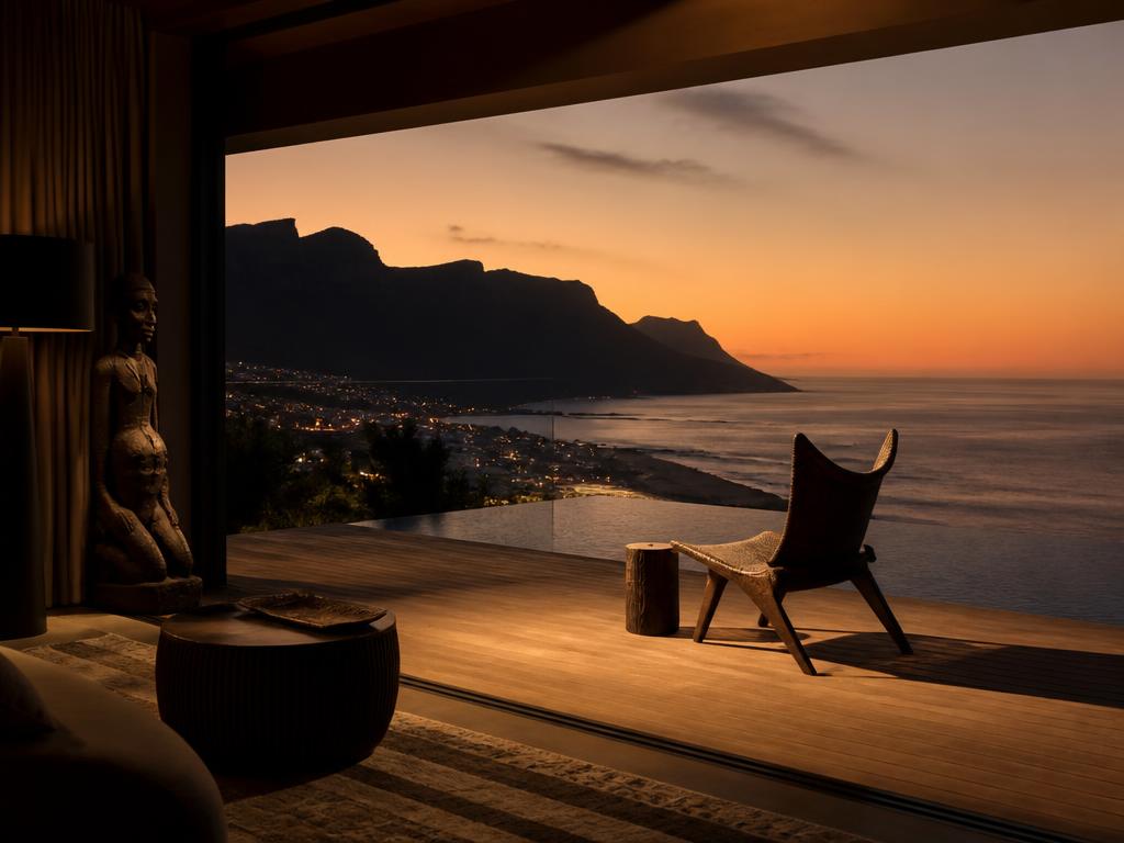 A contemplative Cape Town terrace at dusk, designed for solo reflection and executive reset.